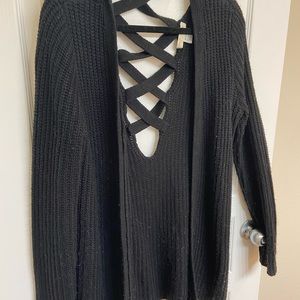 Black knit sweater with criss cross back opening